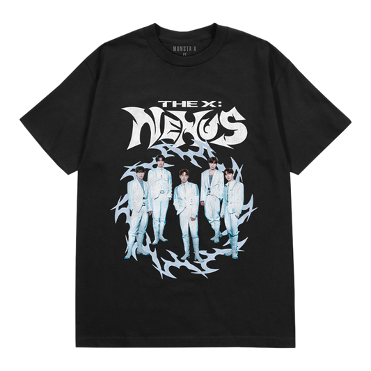 A black short-sleeve graphic t-shirt featuring the band, THE X: NEXUS in stylized white lettering above a circular graphic of five members in white suits surrounded by jagged light blue energy shapes. The brand name 'MONSTA X' is printed inside the collar.